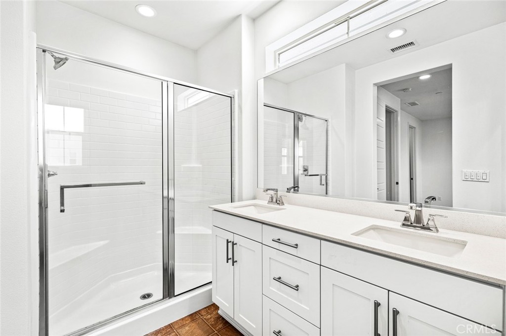 9560 Hammock Place Rancho Cucamonga, CA 91730 - Photo 29 of 48 a bathroom with a shower sink and mirror