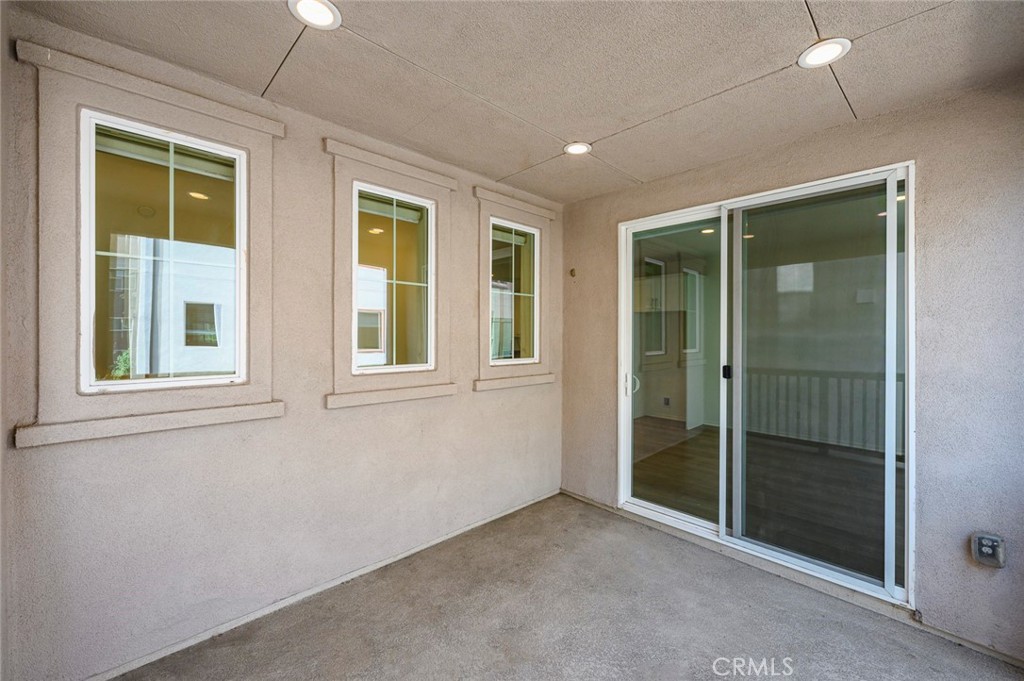 9560 Hammock Place Rancho Cucamonga, CA 91730 - Photo 30 of 48 a view of an entryway with wooden floor and door