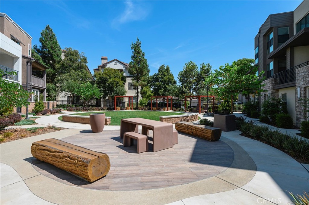 9560 Hammock Place Rancho Cucamonga, CA 91730 - Photo 35 of 48 a view of a patio with couches and a fire pit and a fire pit