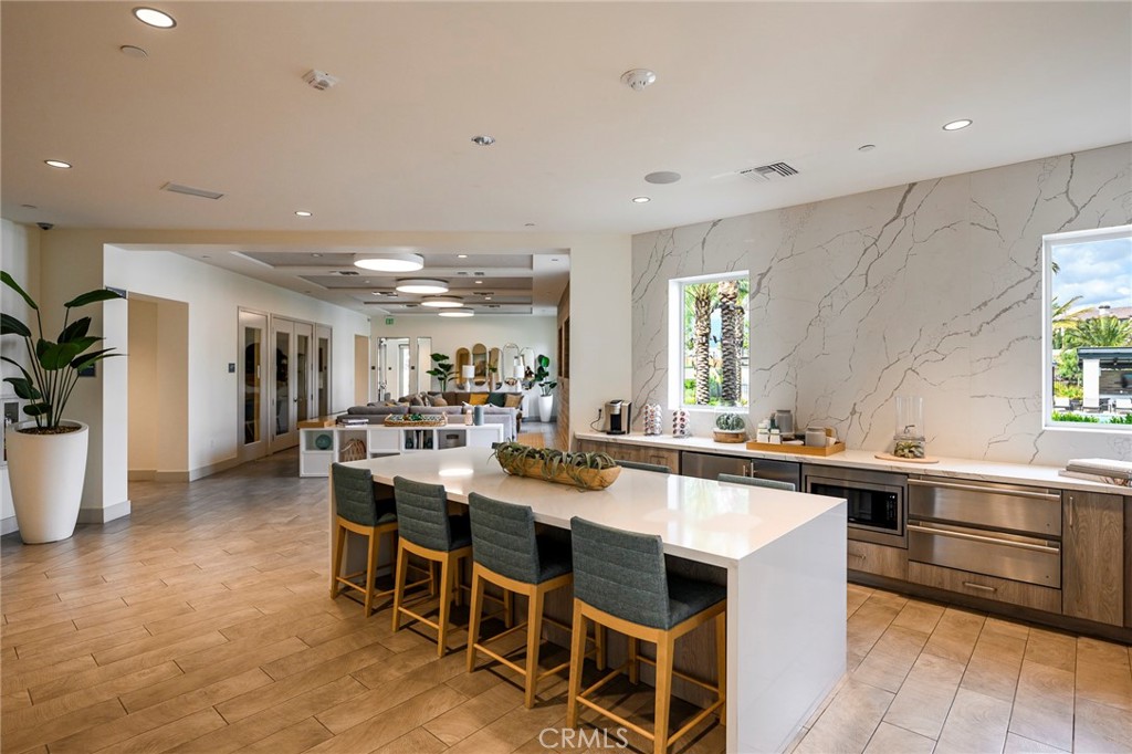 9560 Hammock Place Rancho Cucamonga, CA 91730 - Photo 47 of 48 a large kitchen with a table and chairs