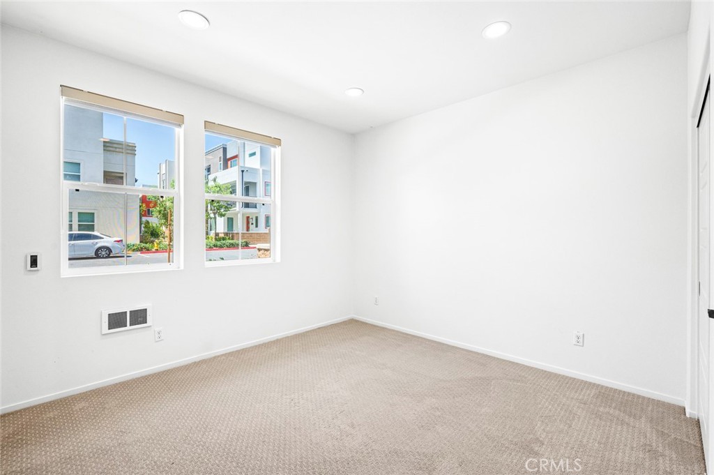 9560 Hammock Place Rancho Cucamonga, CA 91730 - Photo 5 of 48 an empty room with windows
