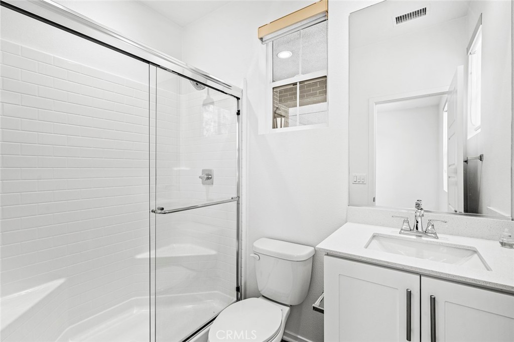 9560 Hammock Place Rancho Cucamonga, CA 91730 - Photo 7 of 48 a bathroom with a sink toilet and shower