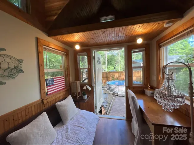 a view of a room with furniture and chandelier