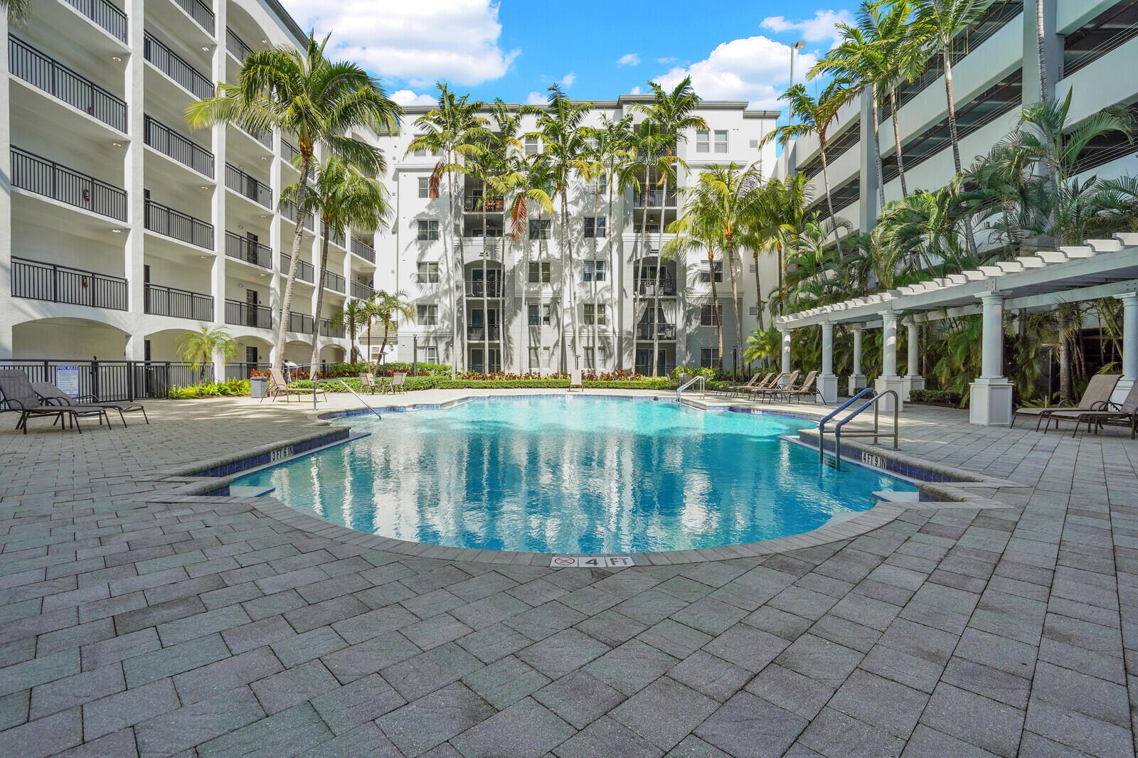 1690 Renaissance Commons Boulevard, Unit 1121 Boynton Beach, FL 33426 - Photo 24 of 32 a view of a swimming pool is middle in the city