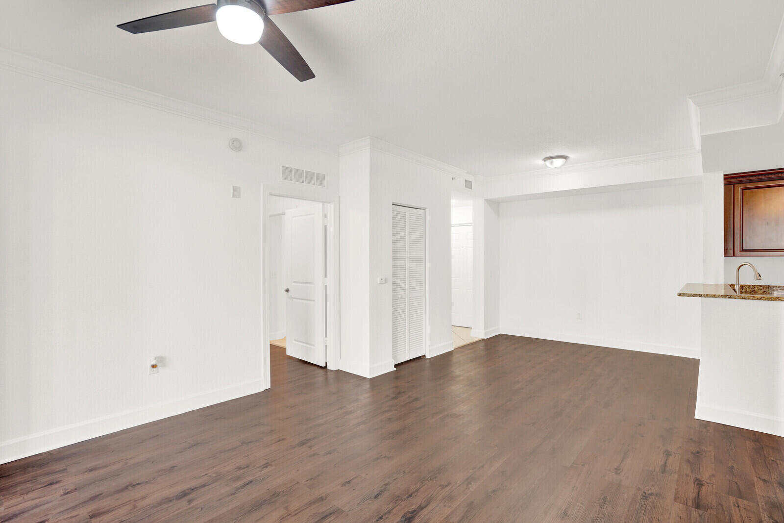 1690 Renaissance Commons Boulevard, Unit 1121 Boynton Beach, FL 33426 - Photo 6 of 32 a view of a room with wooden floor