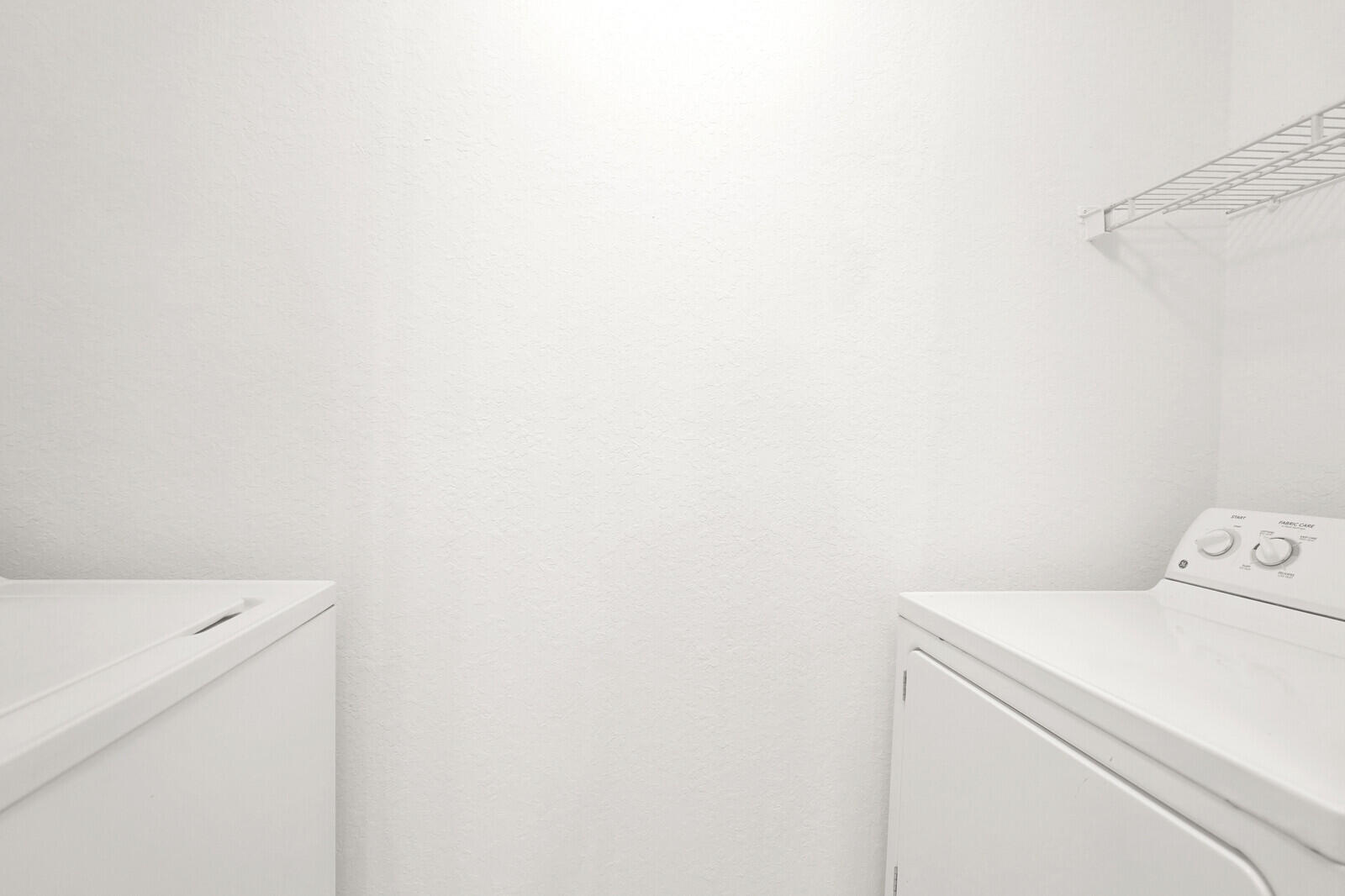 1690 Renaissance Commons Boulevard, Unit 1121 Boynton Beach, FL 33426 - Photo 9 of 32 a utility room with dryer and washer