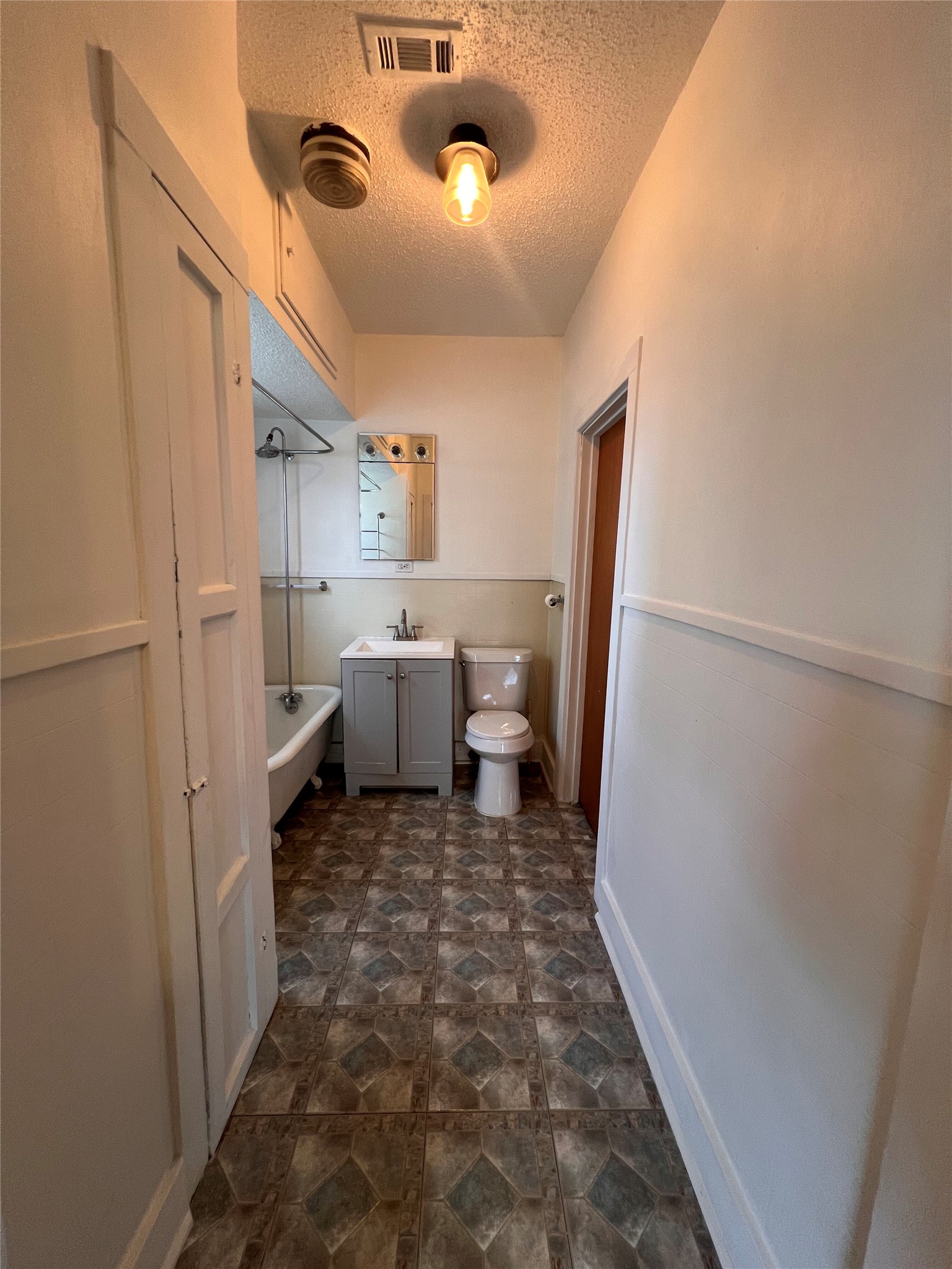 941 East 52nd Street Austin, TX 78751 - Photo 13 of 26 a view of a storage & utility room with a sink
