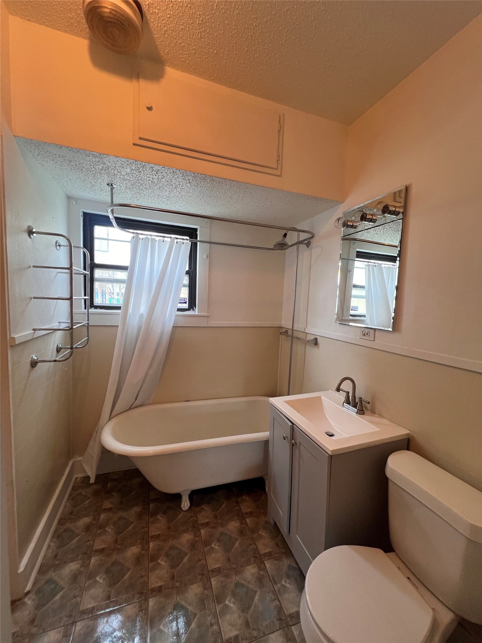 941 East 52nd Street Austin, TX 78751 - Photo 14 of 26 a bathroom with a sink a toilet and shower