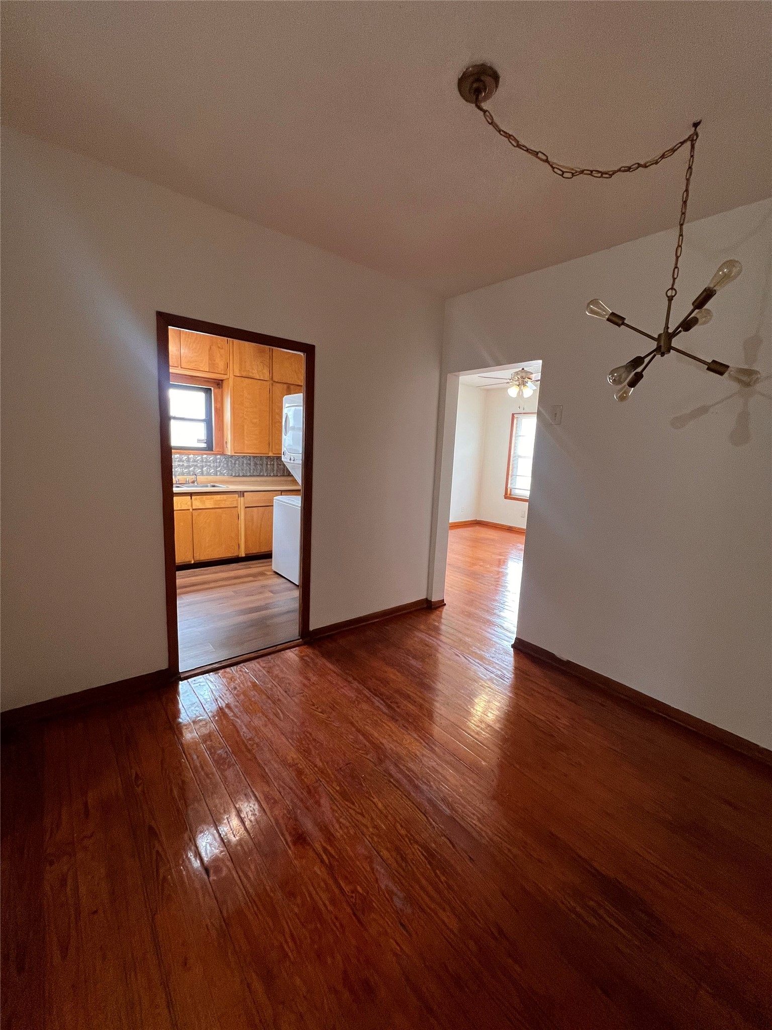 941 East 52nd Street Austin, TX 78751 - Photo 15 of 26 a view of empty room with wooden floor and fan