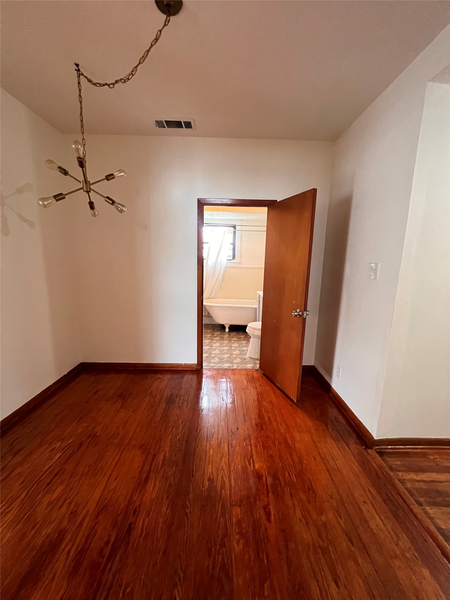 941 East 52nd Street Austin, TX 78751 - Photo 18 of 26 a view of an empty room and wooden floor