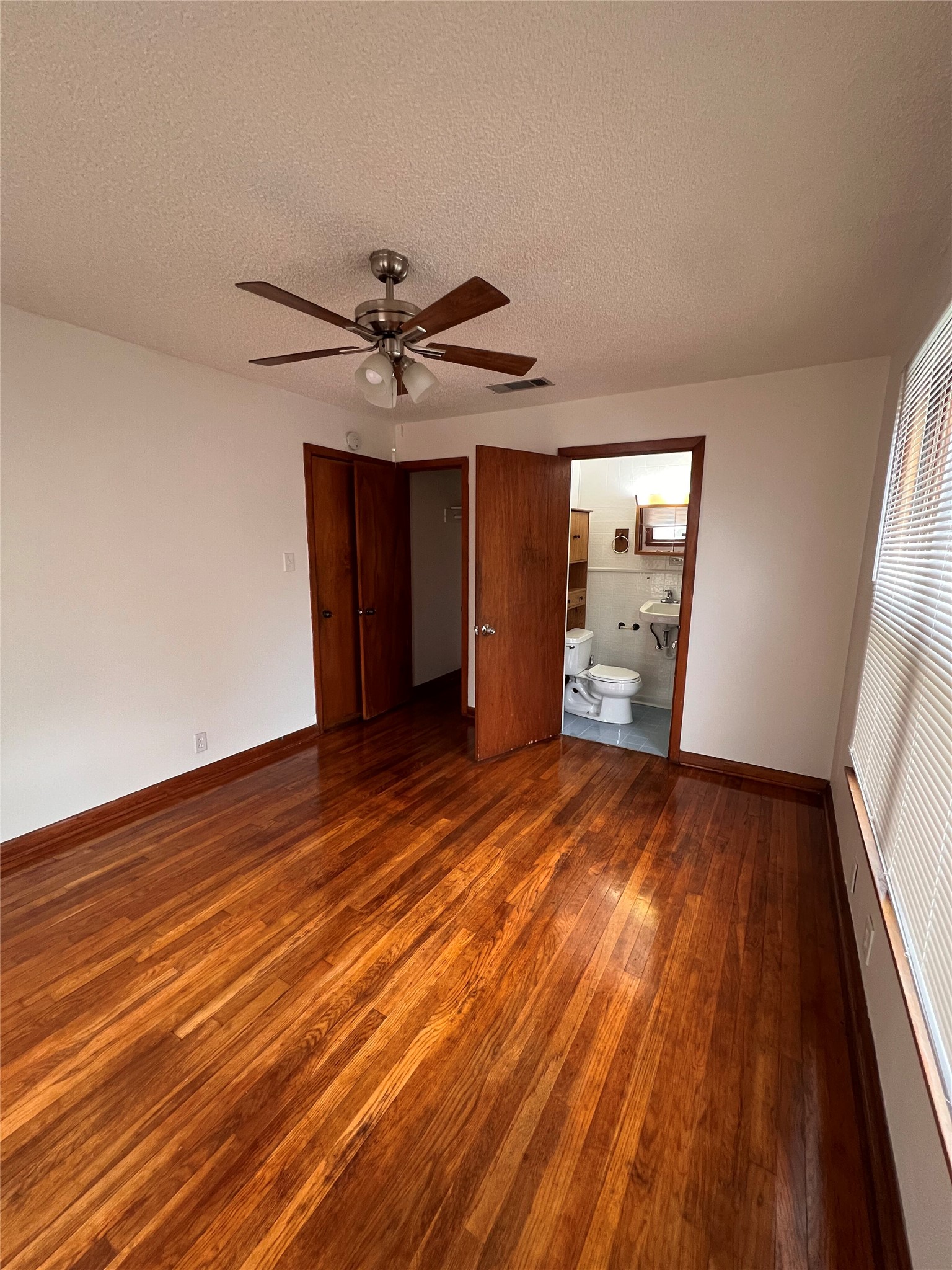 941 East 52nd Street Austin, TX 78751 - Photo 25 of 26 wooden floor in an empty room with a window