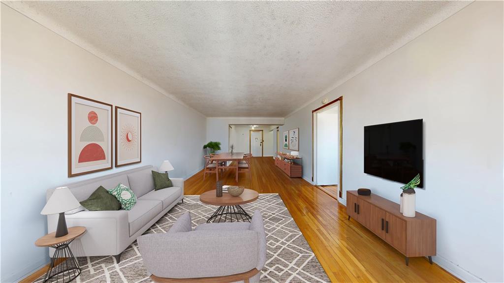 7401 Shore Road, Unit 6F Brooklyn, NY 11209 - Photo 1 of 14 a living room with furniture and a flat screen tv
