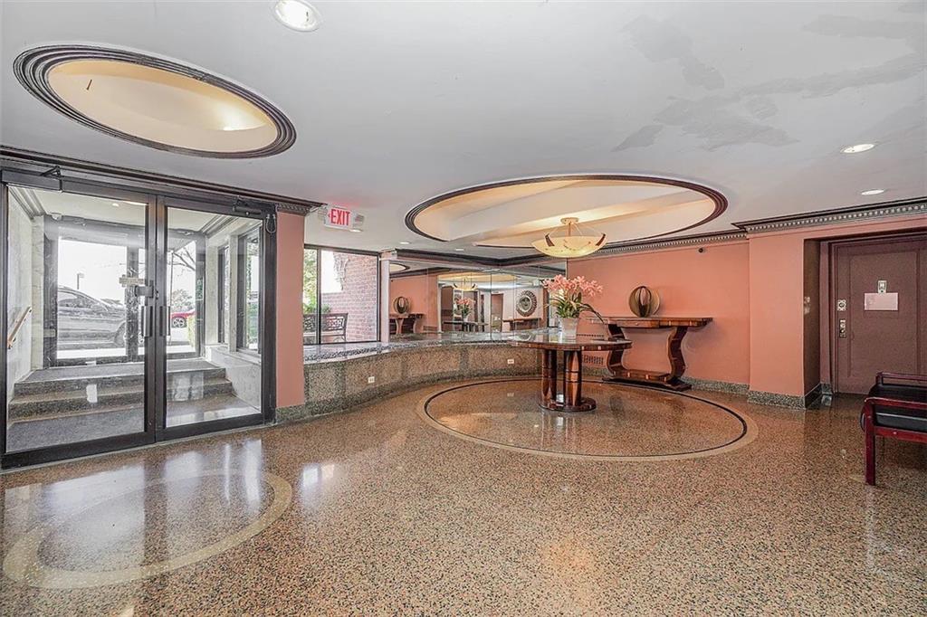 7401 Shore Road, Unit 6F Brooklyn, NY 11209 - Photo 13 of 14 a swimming pool with table and chairs