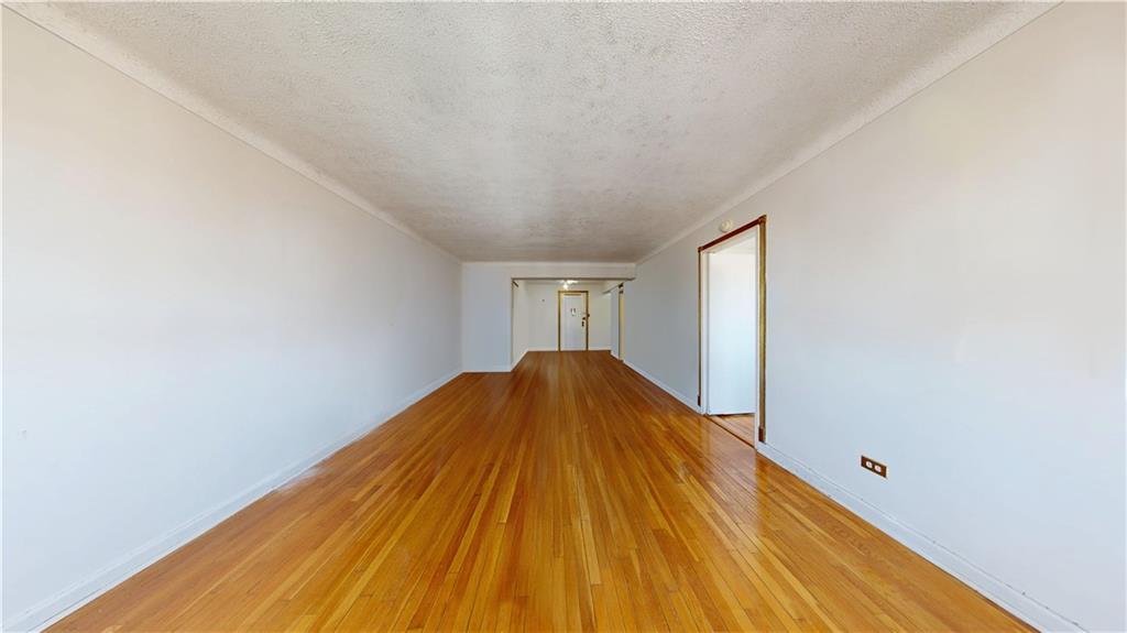 7401 Shore Road, Unit 6F Brooklyn, NY 11209 - Photo 7 of 14 a view of a big room with wooden floor