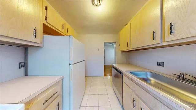 a kitchen with a sink a stove and cabinets
