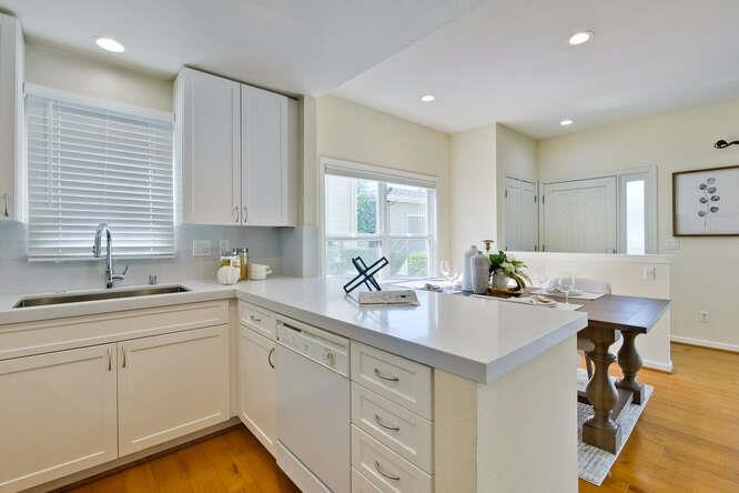 Cottage Court Mountain View, CA 94043 - Photo 15 of 43 a kitchen with a sink cabinets and window