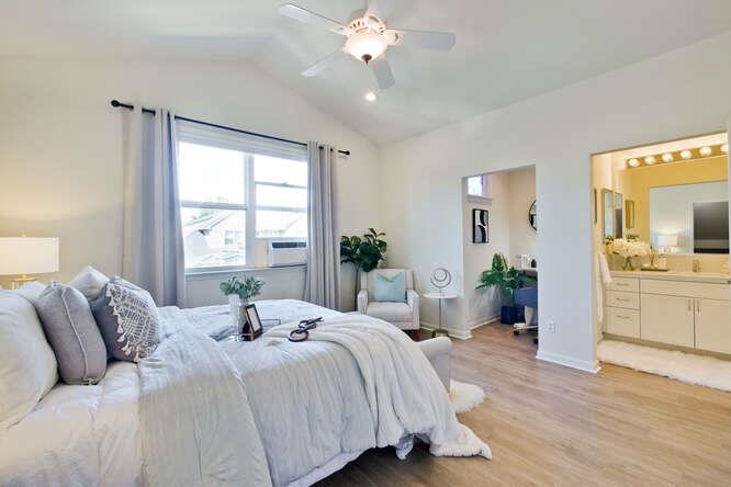 Cottage Court Mountain View, CA 94043 - Photo 17 of 43 a bedroom with a large bed potted plant and windows