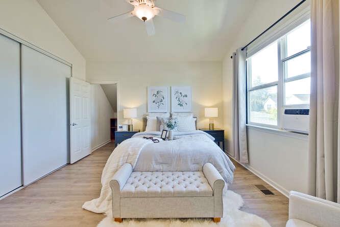 Cottage Court Mountain View, CA 94043 - Photo 19 of 43 a bed room with a bed and a large window