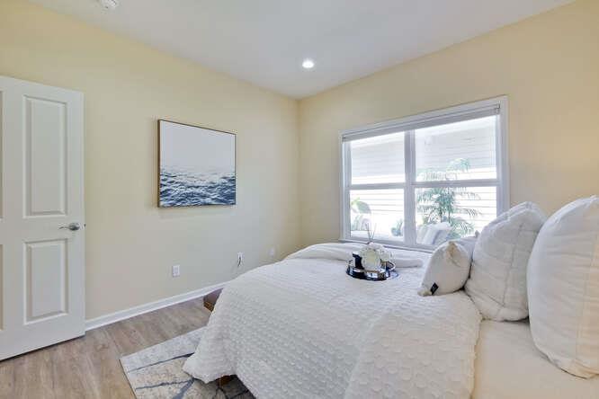 Cottage Court Mountain View, CA 94043 - Photo 26 of 43 a bedroom with a bed and wooden floor