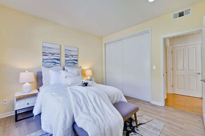 Cottage Court Mountain View, CA 94043 - Photo 27 of 43 a bedroom with a bed and wooden floor