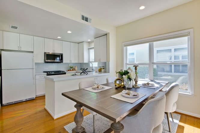 Cottage Court Mountain View, CA 94043 - Photo 10 of 43 a kitchen with a table and chairs in it