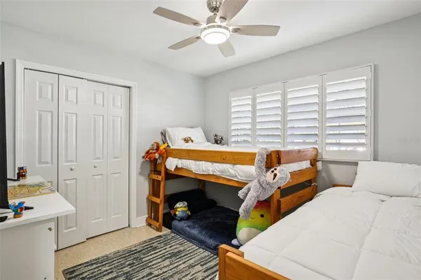 a bed room with a bed and a tv