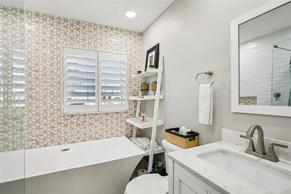 a bathroom with a sink and a bathtub