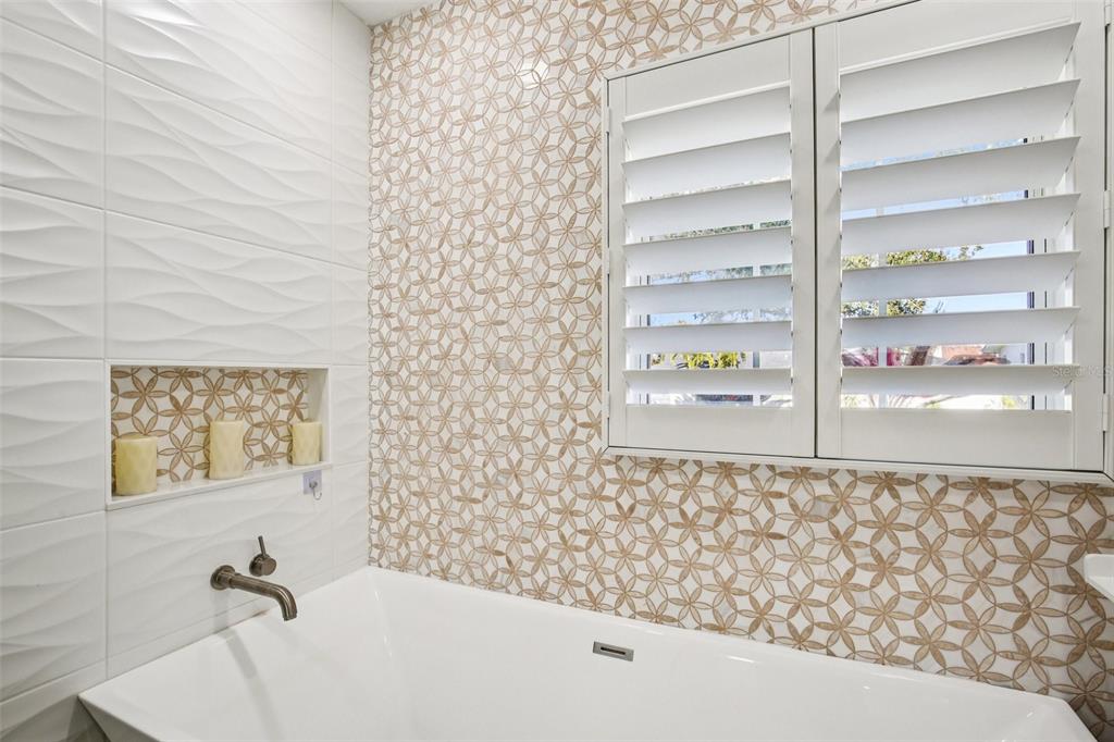 3966 High Bluff Drive Largo, FL 33770 - Photo 16 of 40 a bathroom with a bathtub and shower