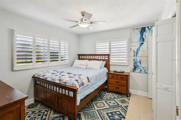 a bedroom with a bed and a window in it