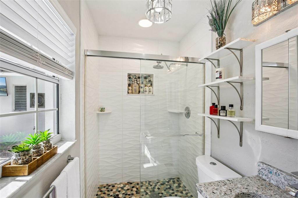 3966 High Bluff Drive Largo, FL 33770 - Photo 22 of 40 a bathroom with a shower