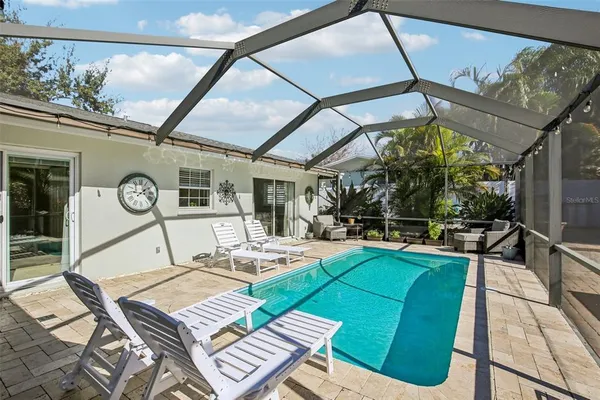 a view of a patio with couches table and chairs
