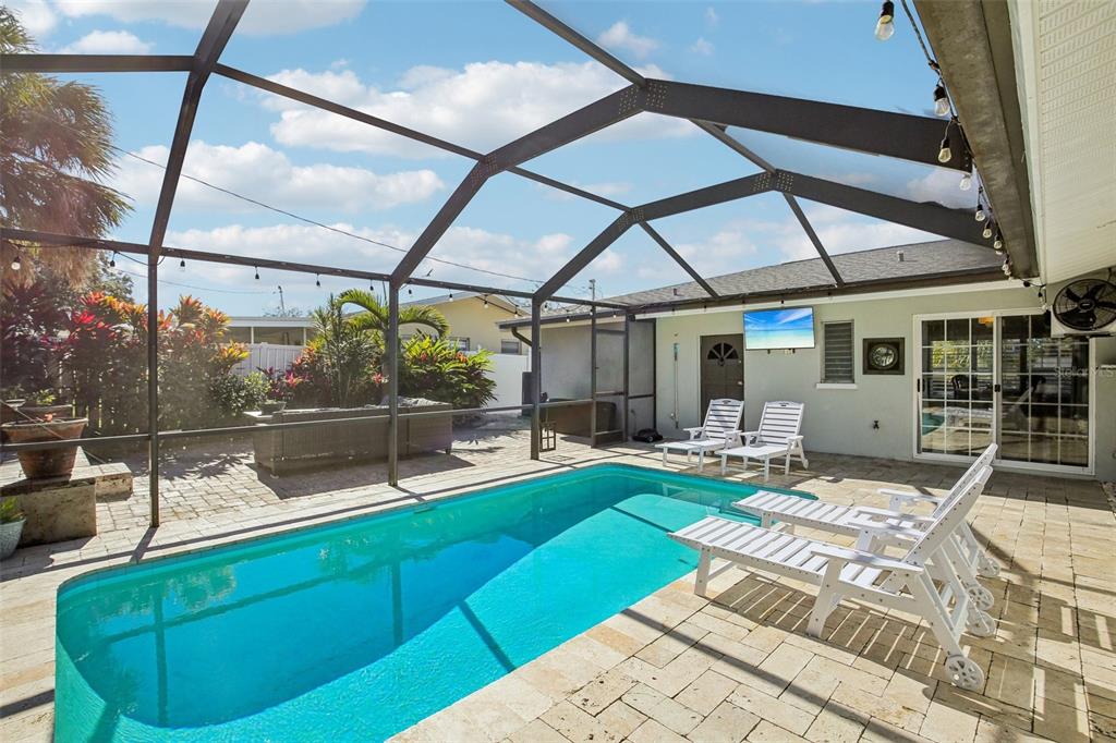 3966 High Bluff Drive Largo, FL 33770 - Photo 32 of 40 a view of a patio with couches chairs and potted plants