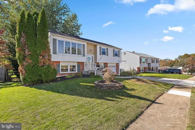 a view of a house with swimming pool and a yard