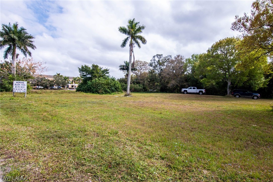 6256 Scott Street Punta Gorda, FL 33950 - Photo 12 of 21 a view of a swimming pool and trees in the background