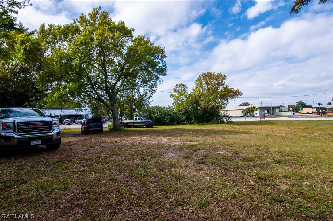6256 Scott Street Punta Gorda, FL 33950 - Photo 17 of 21 a view of outdoor space with deck and trees