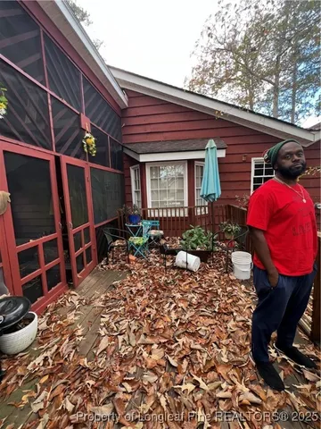 a view of a chairs and table in backyard
