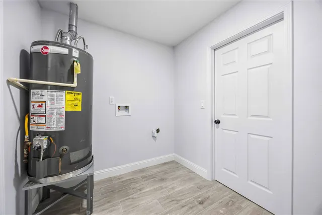 a view of an entryway with wooden floor