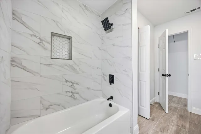 a bathroom with a bathtub