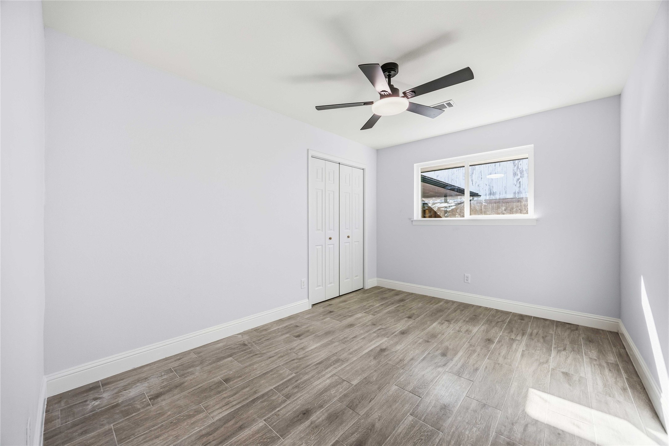 8115 Tarbell Road Houston, TX 77034 - Photo 15 of 24 a view of empty room with wooden floor