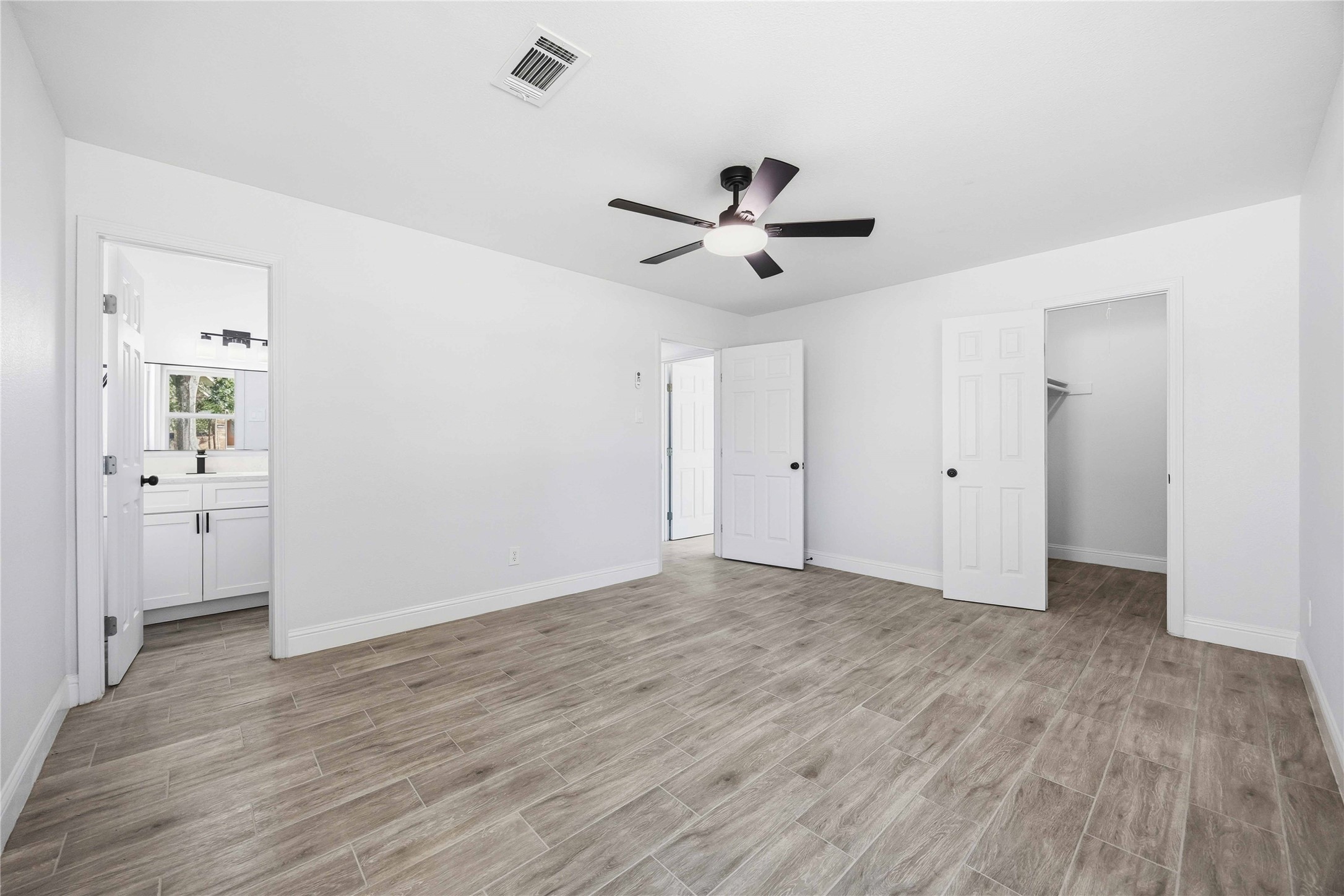 8115 Tarbell Road Houston, TX 77034 - Photo 18 of 24 a view of an empty room with wooden floor