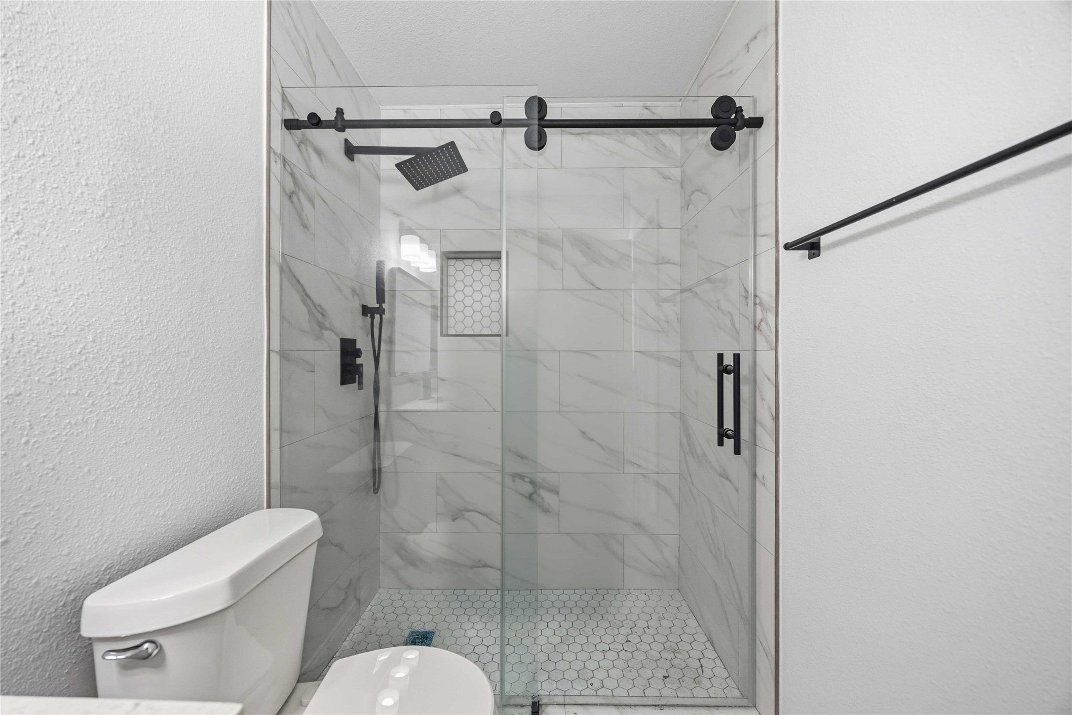 8115 Tarbell Road Houston, TX 77034 - Photo 19 of 24 a bathroom with a shower and toilet