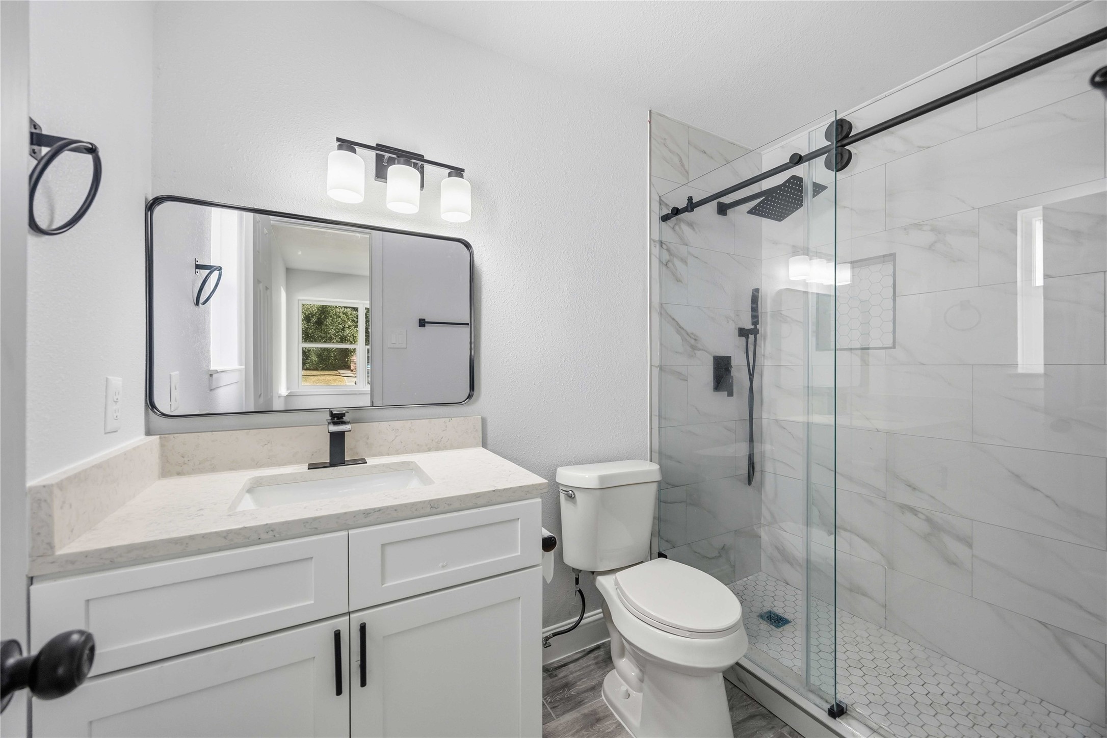 8115 Tarbell Road Houston, TX 77034 - Photo 20 of 24 a bathroom with a sink toilet and shower
