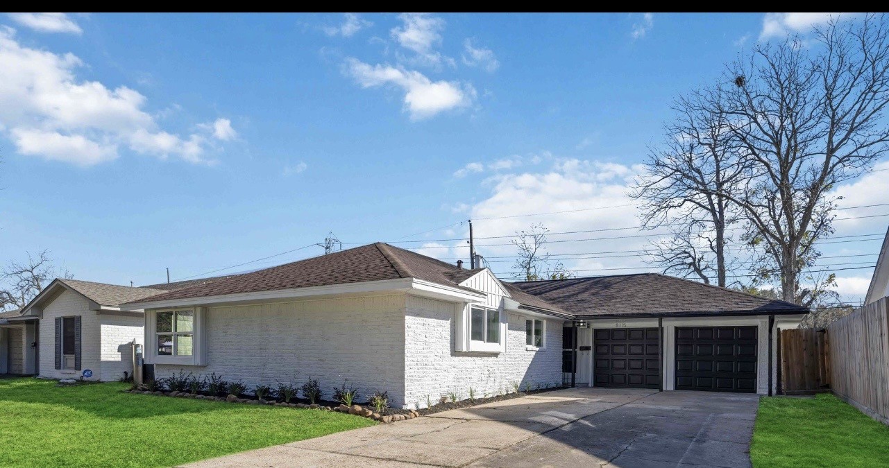 8115 Tarbell Road Houston, TX 77034 - Photo 2 of 24 a front view of a house with a garden