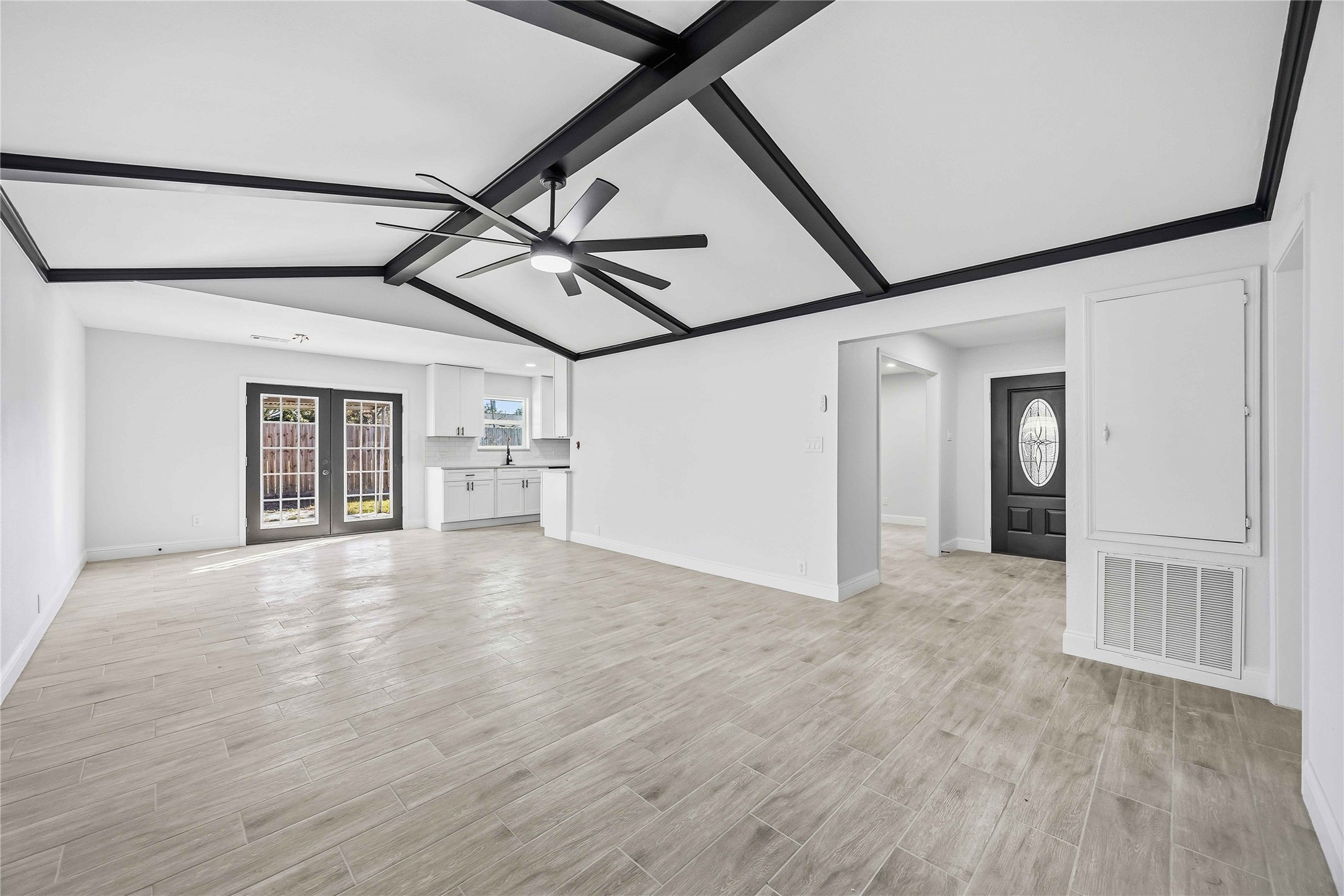 8115 Tarbell Road Houston, TX 77034 - Photo 7 of 24 a view of empty room with wooden floor