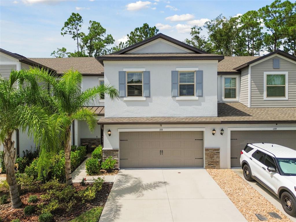 1333 White Fox Run Lutz, FL 33549 - Photo 1 of 1 a front view of a house with a garage