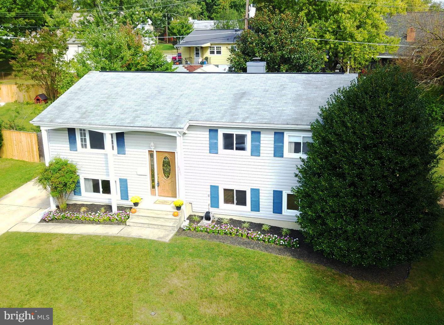 6208 Collinsway Road Baltimore, MD 21228 - Photo 1 of 22 a front view of a house with garden