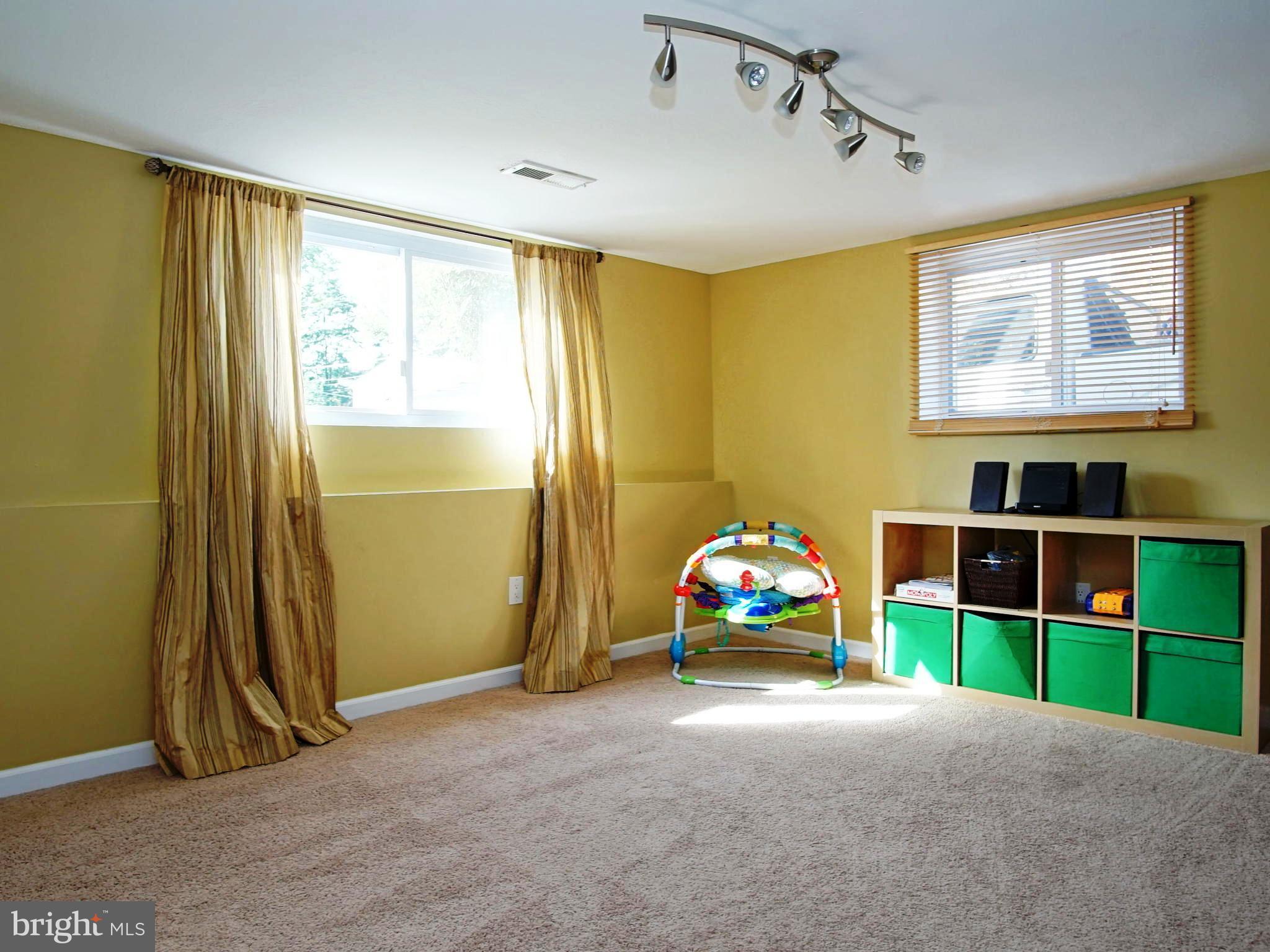 6208 Collinsway Road Baltimore, MD 21228 - Photo 13 of 22 a view of room with toys and a window