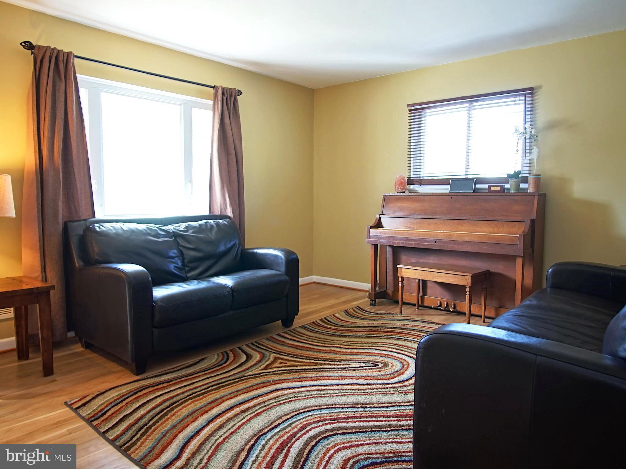 6208 Collinsway Road Baltimore, MD 21228 - Photo 6 of 22 a living room with furniture and a window