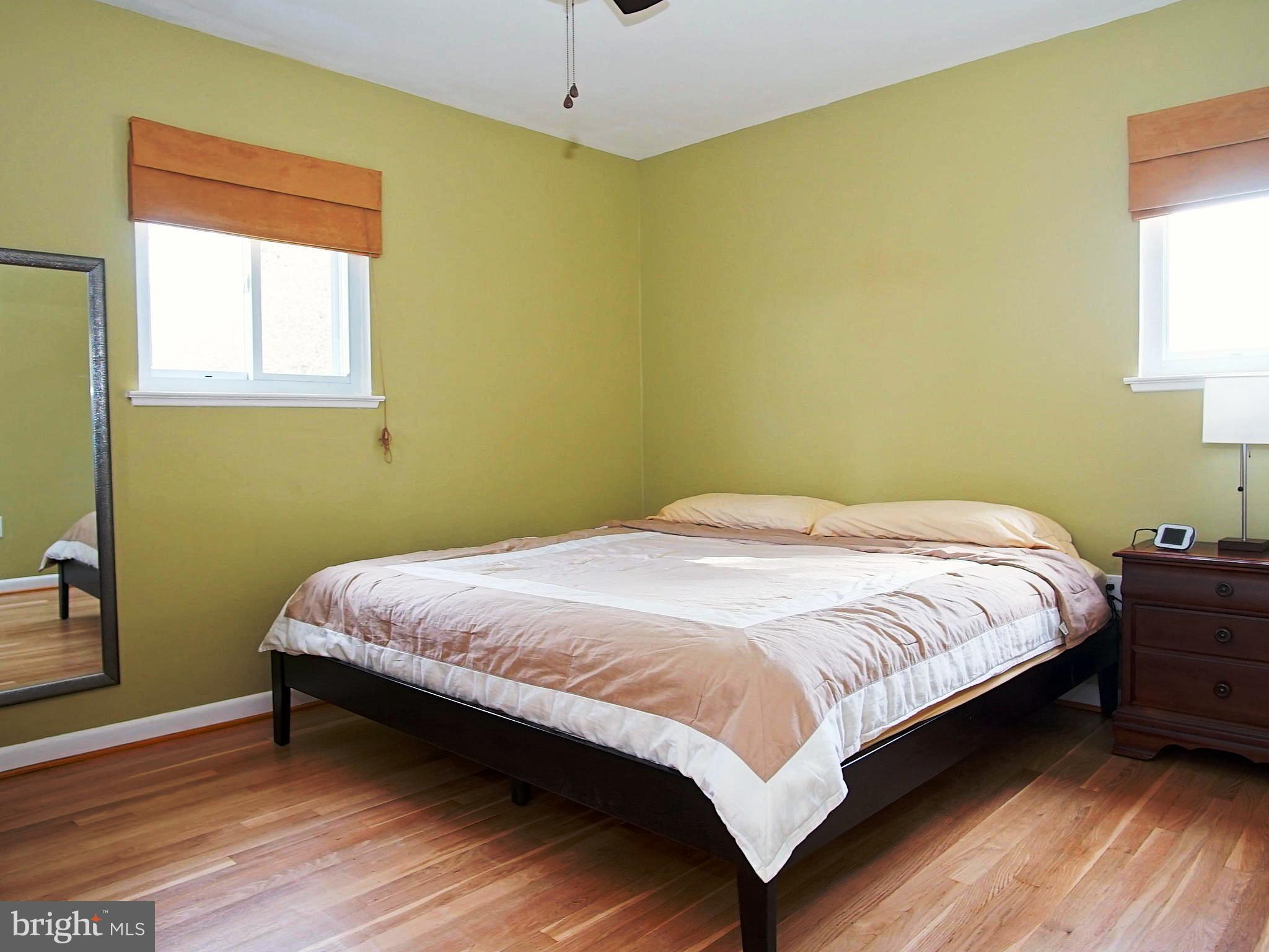 6208 Collinsway Road Baltimore, MD 21228 - Photo 7 of 22 a bedroom with a bed and a window