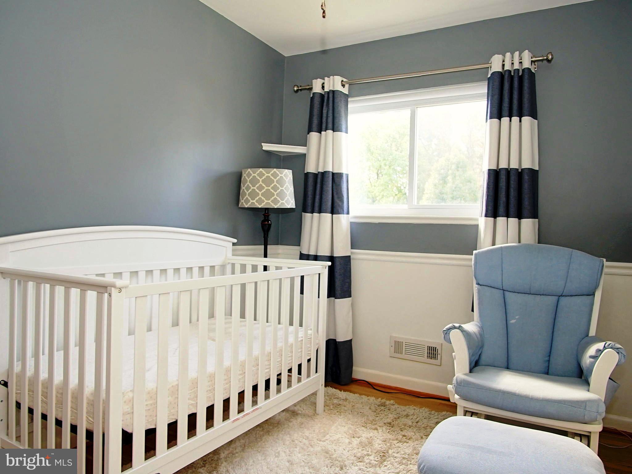 6208 Collinsway Road Baltimore, MD 21228 - Photo 9 of 22 a bedroom with furniture and a window